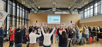 Bewegungspause mit den Teilnehmenden